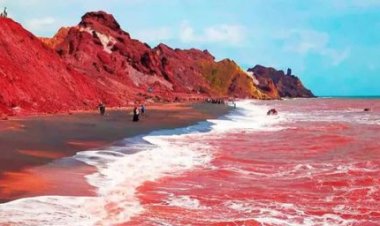 Heavy Rain Turns Iran’s Hormuz Island Shoreline Deep Red
